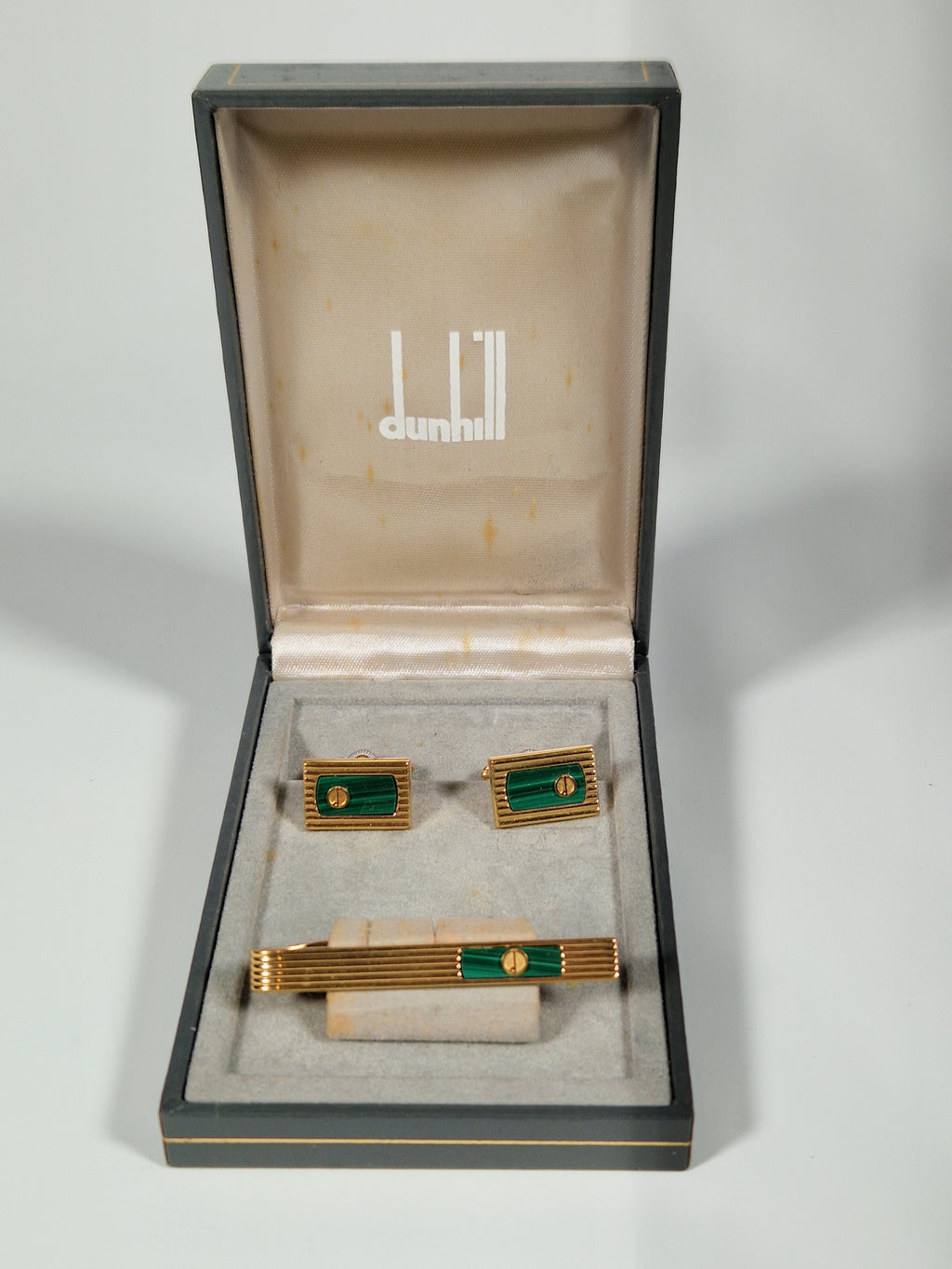 A pair of cufflinks and tiepin from Dunhill