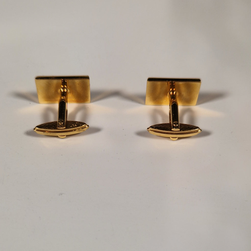 A pair of cufflinks and tiepin from Dunhill