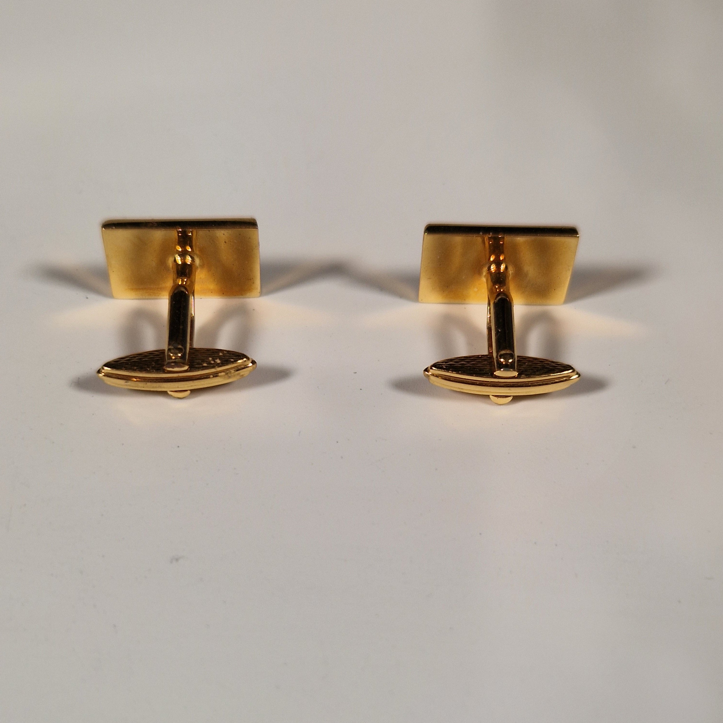 A pair of cufflinks and tiepin from Dunhill