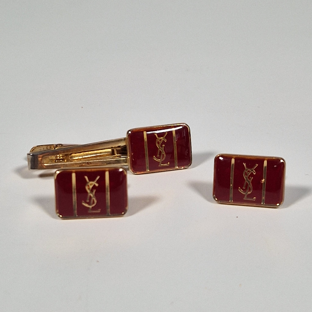 Yves Saint laurent a pair of cufflinks and a tie pin