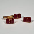 Yves Saint laurent a pair of cufflinks and a tie pin