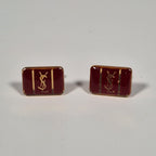 Yves Saint laurent a pair of cufflinks and a tie pin