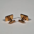Yves Saint laurent a pair of cufflinks and a tie pin