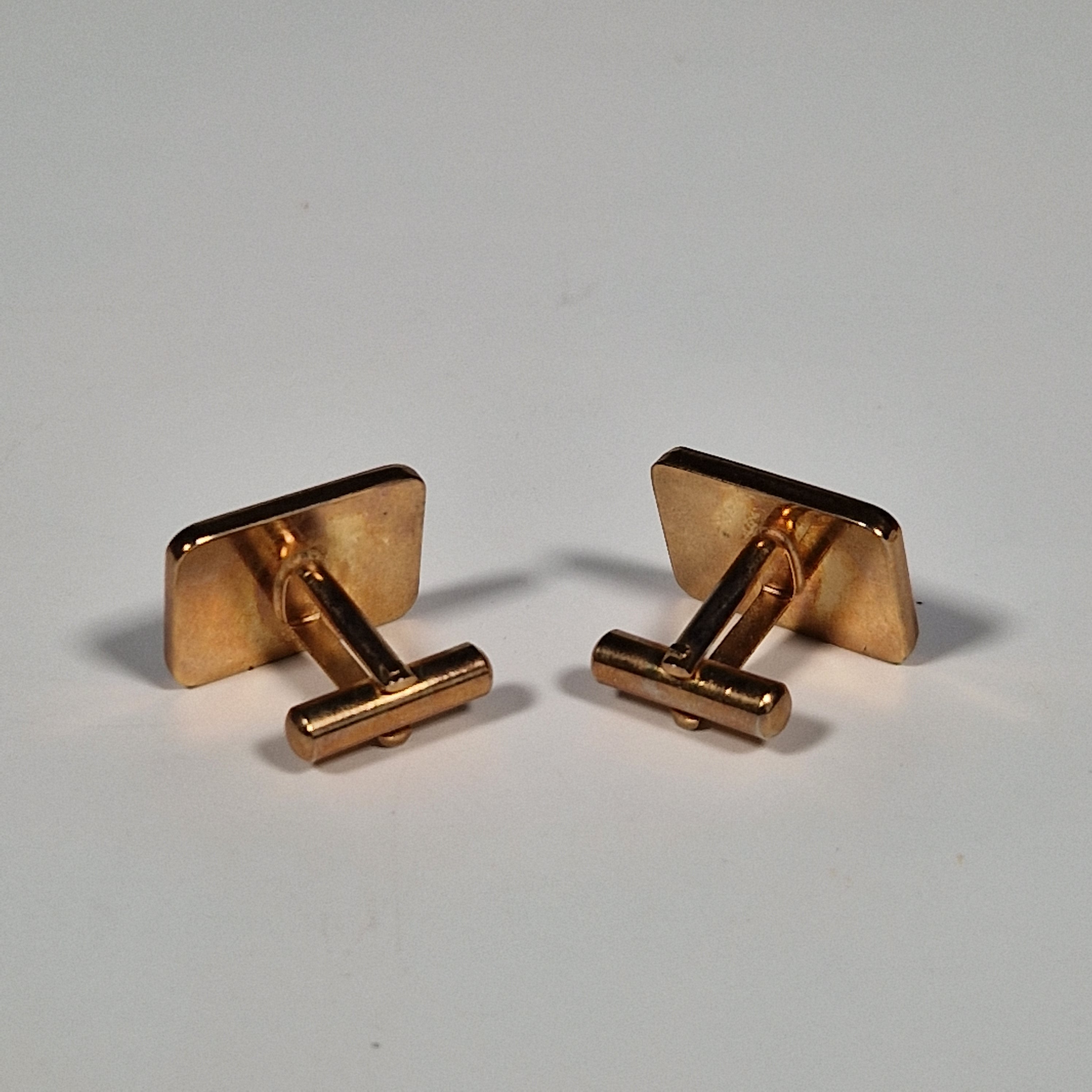 Yves Saint laurent a pair of cufflinks and a tie pin