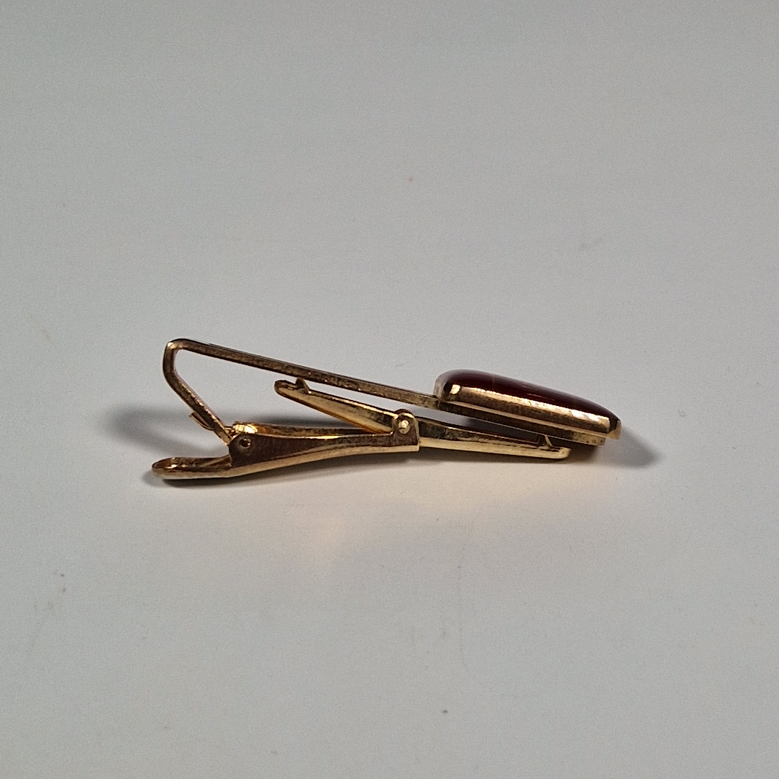 Yves Saint laurent a pair of cufflinks and a tie pin
