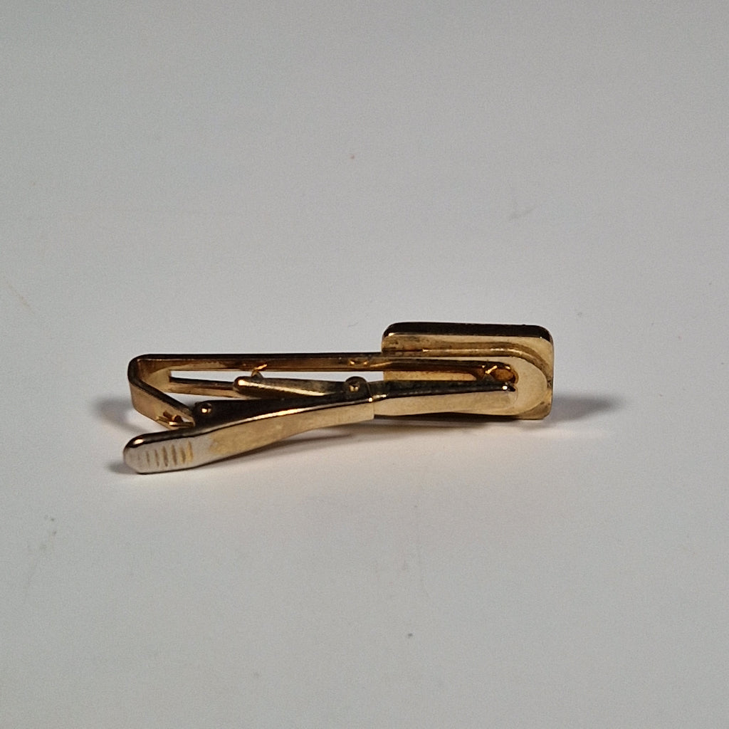 Yves Saint laurent a pair of cufflinks and a tie pin