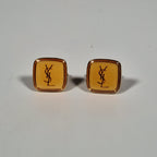Yves Saint laurent a pair of cufflinks and a tie pin