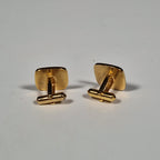 Yves Saint laurent a pair of cufflinks and a tie pin