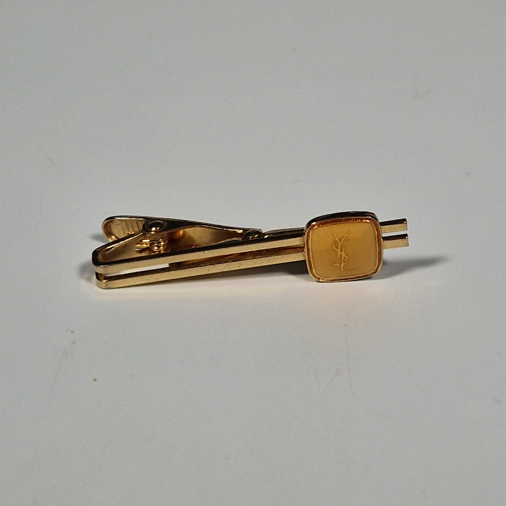 Yves Saint laurent a pair of cufflinks and a tie pin