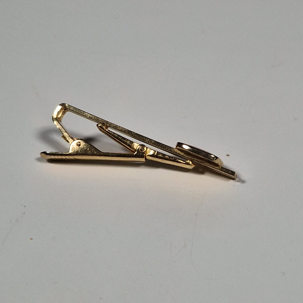 Yves Saint laurent a pair of cufflinks and a tie pin