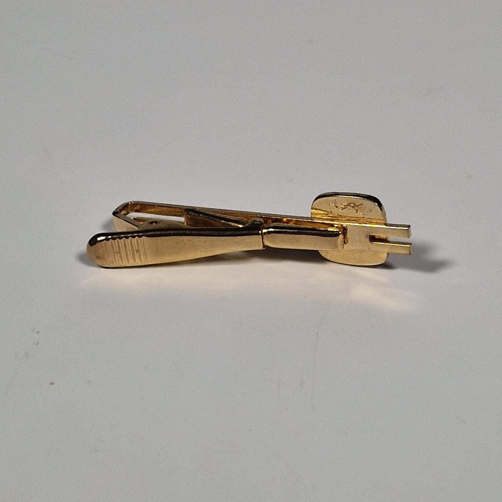 Yves Saint laurent a pair of cufflinks and a tie pin