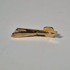 Yves Saint laurent a pair of cufflinks and a tie pin