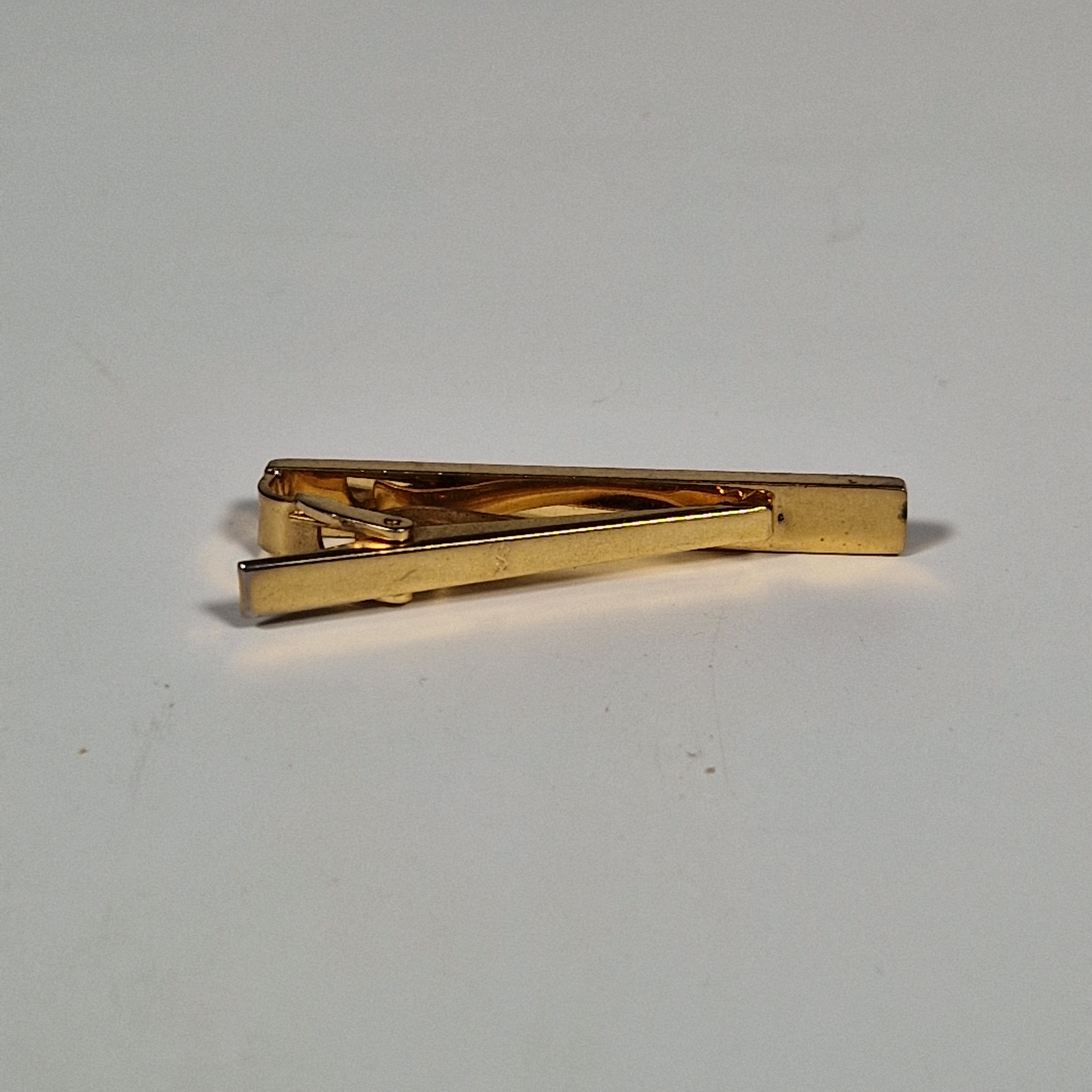 Yves Saint Laurent a tie pin