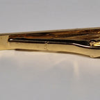Yves Saint Laurent a tie pin