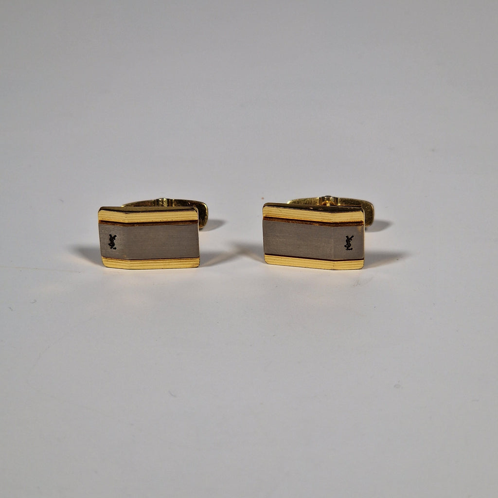 Yves Saint Laurent a pair of cufflinks.