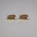 Yves Saint Laurent a pair of cufflinks.
