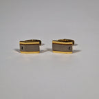 Yves Saint Laurent a pair of cufflinks.
