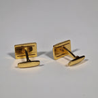 Yves Saint Laurent a pair of cufflinks.