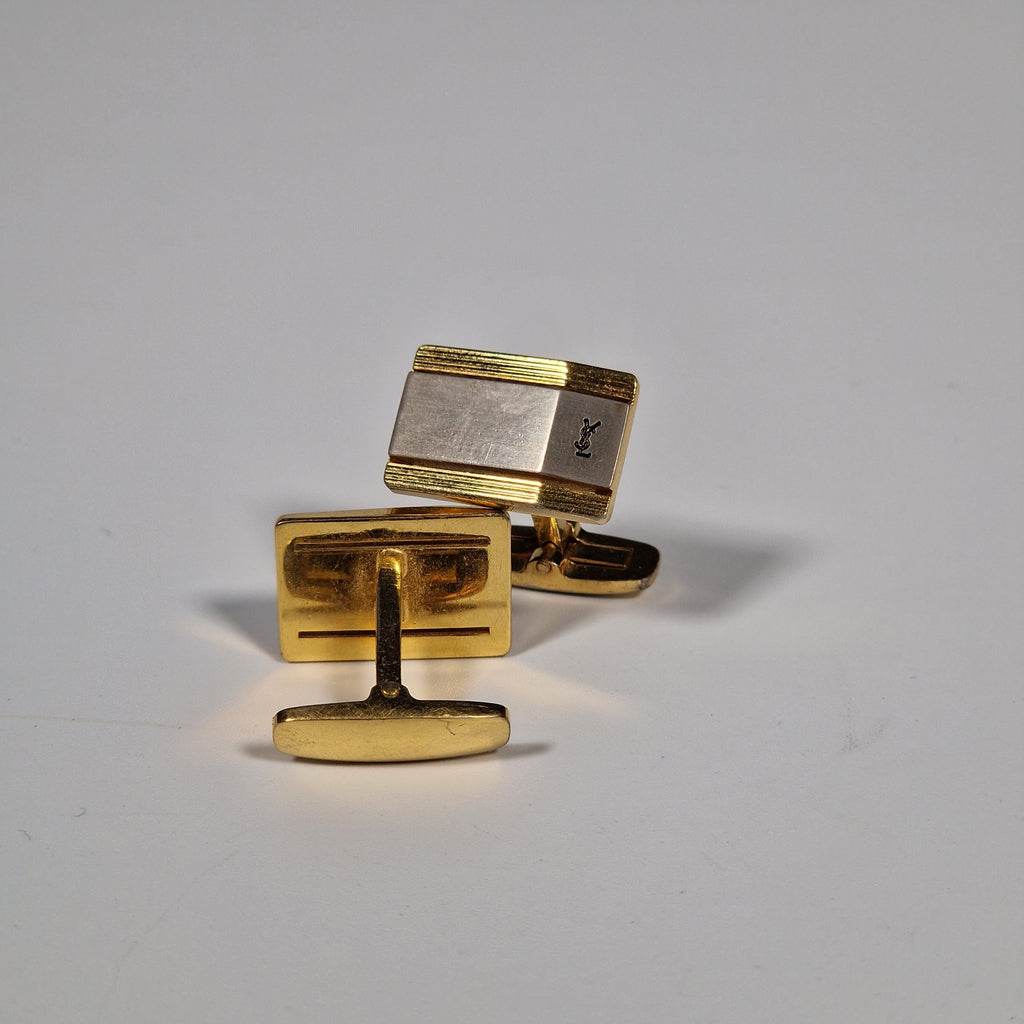 Yves Saint Laurent a pair of cufflinks.