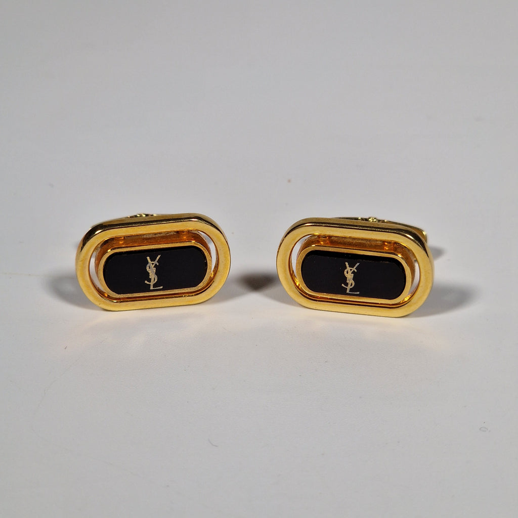 Yves Saint Laurent a pair of cufflinks.