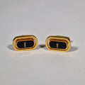 Yves Saint Laurent a pair of cufflinks.
