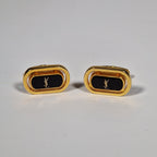 Yves Saint Laurent a pair of cufflinks.