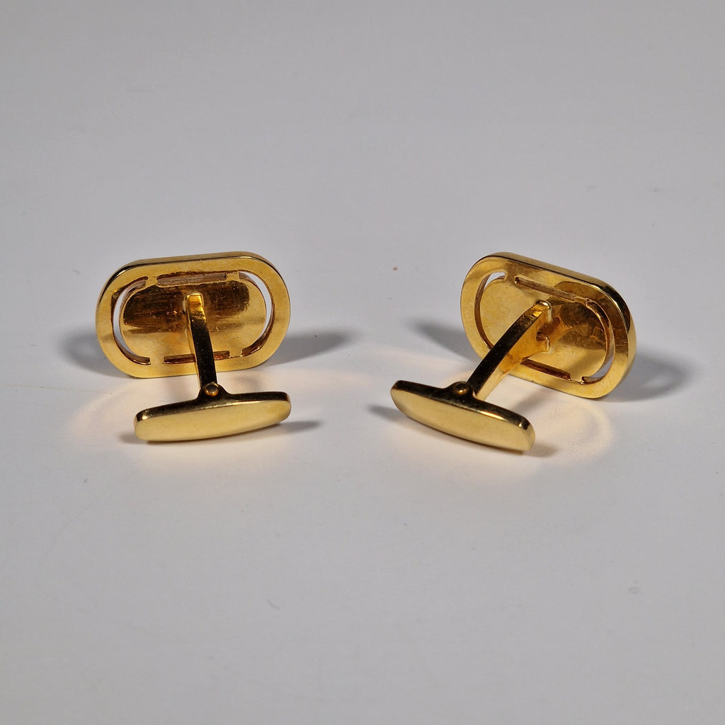 Yves Saint Laurent a pair of cufflinks.
