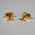 Yves Saint Laurent a pair of cufflinks.