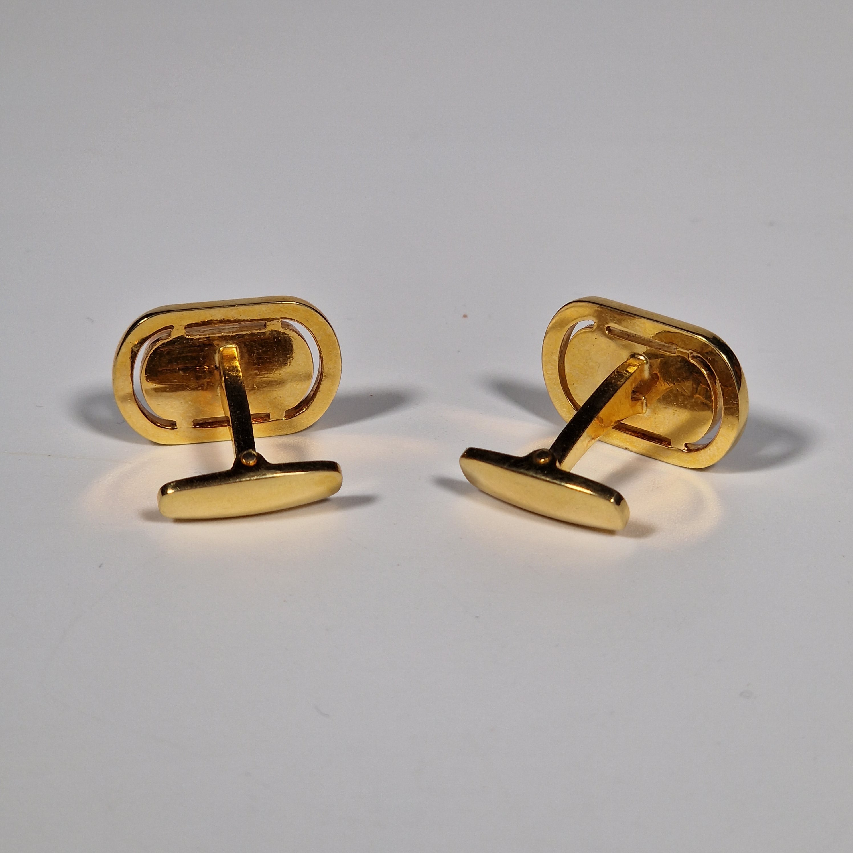 Yves Saint Laurent a pair of cufflinks.