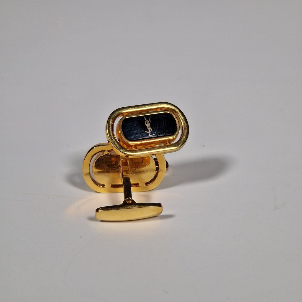 Yves Saint Laurent a pair of cufflinks.