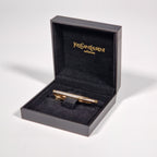 Yves Saint Laurent a tie pin with box.