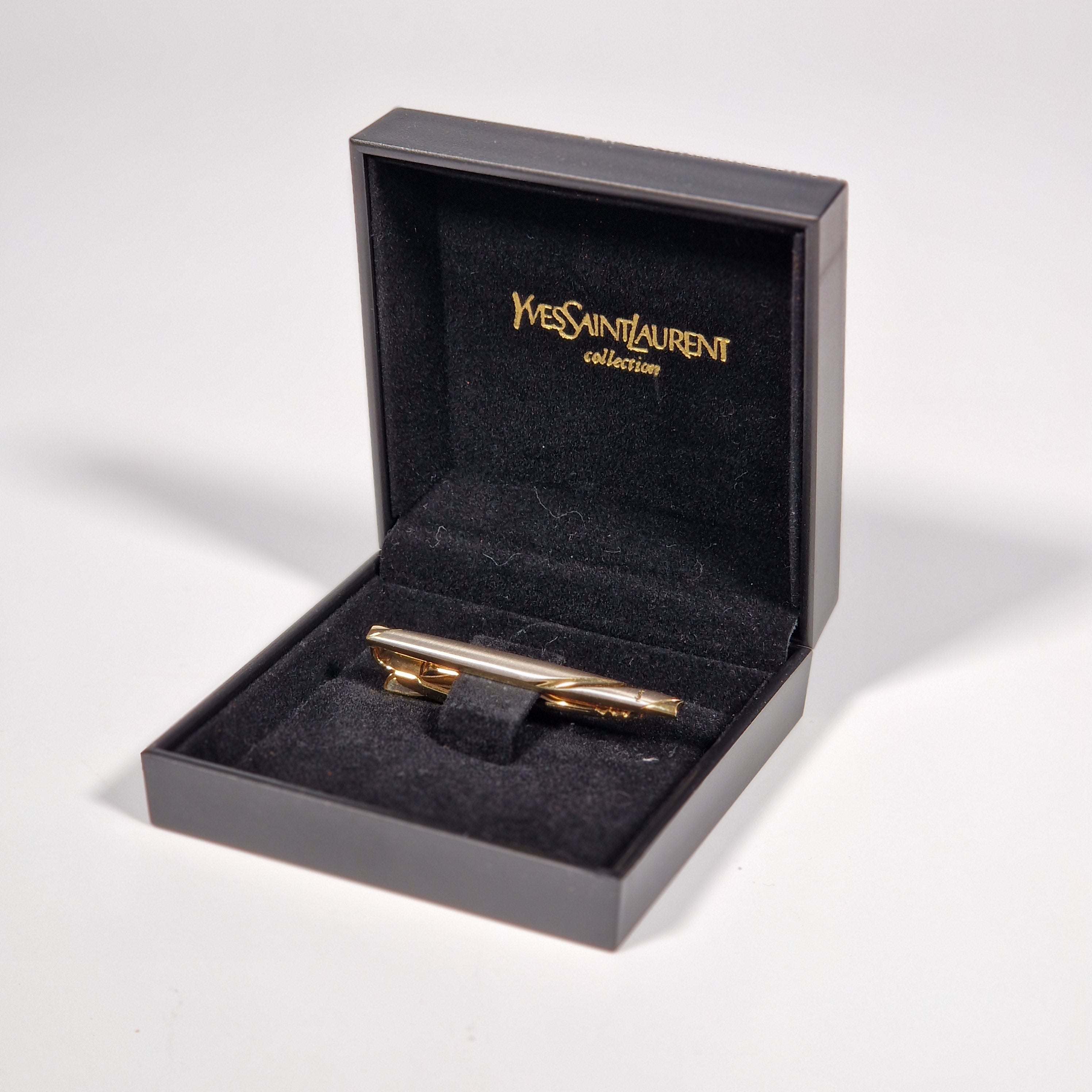 Yves Saint Laurent a tie pin with box.
