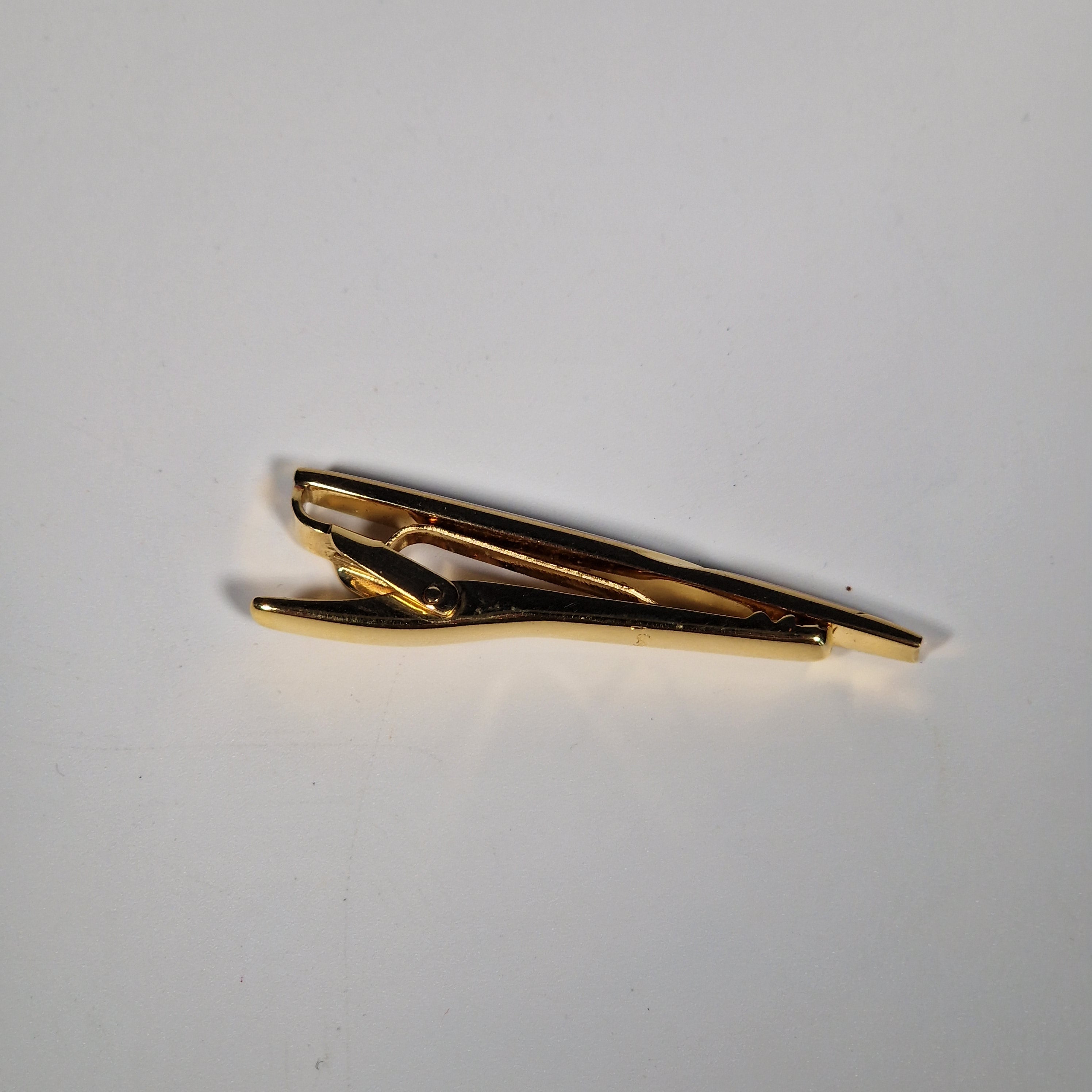 Yves Saint Laurent a tie pin with box.