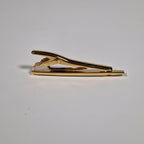 Yves Saint Laurent a tie pin with box.