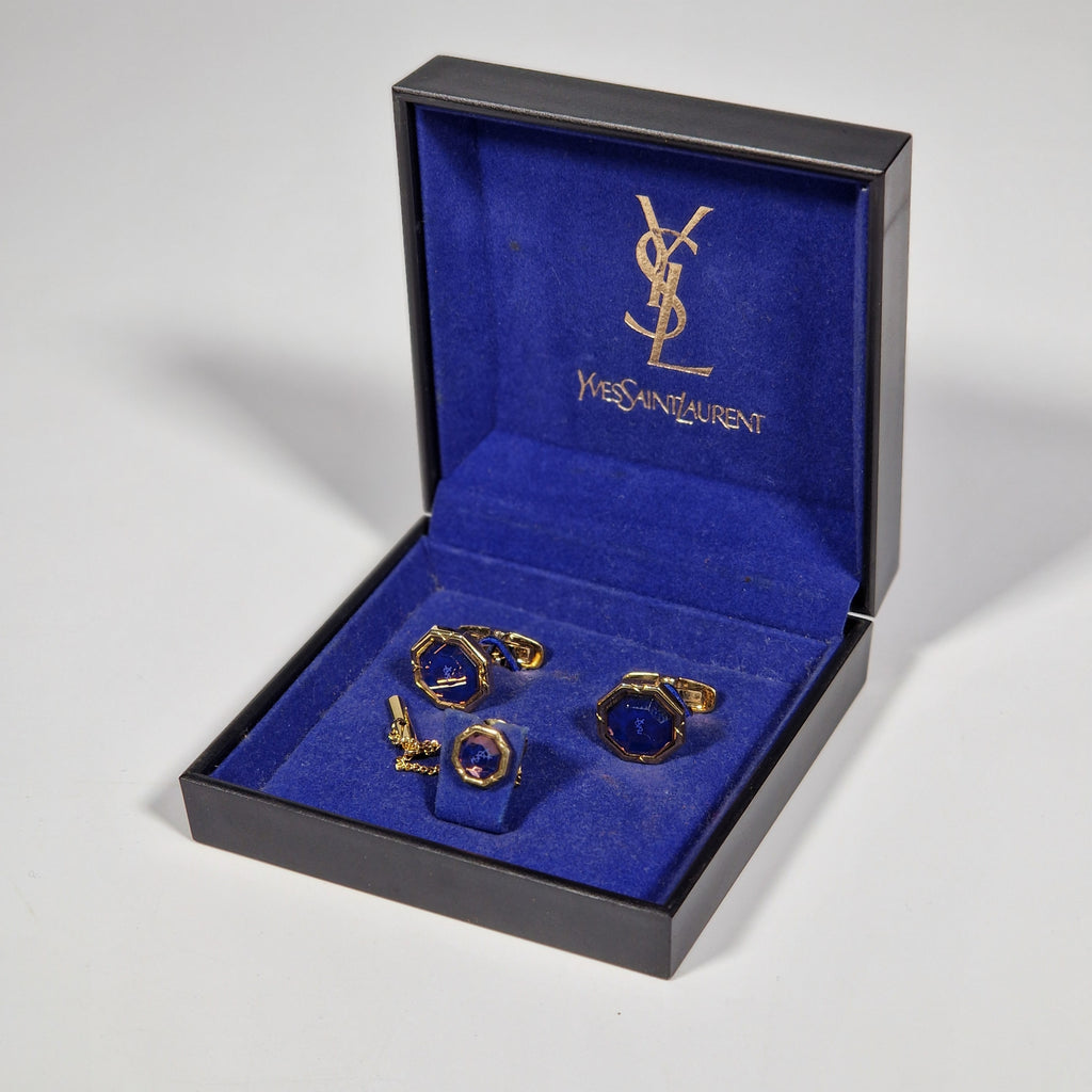 Yves Saint Laurent a pair of cufflinks and a tie pin with box.
