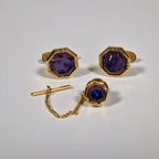 Yves Saint Laurent a pair of cufflinks and a tie pin with box.