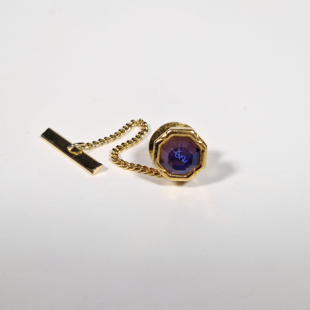 Yves Saint Laurent a pair of cufflinks and a tie pin with box.