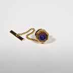 Yves Saint Laurent a pair of cufflinks and a tie pin with box.