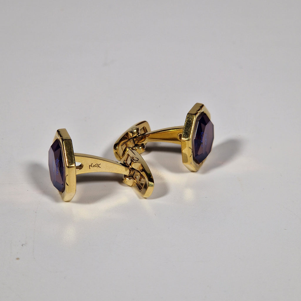 Yves Saint Laurent a pair of cufflinks and a tie pin with box.
