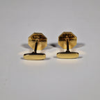 Yves Saint Laurent a pair of cufflinks and a tie pin with box.
