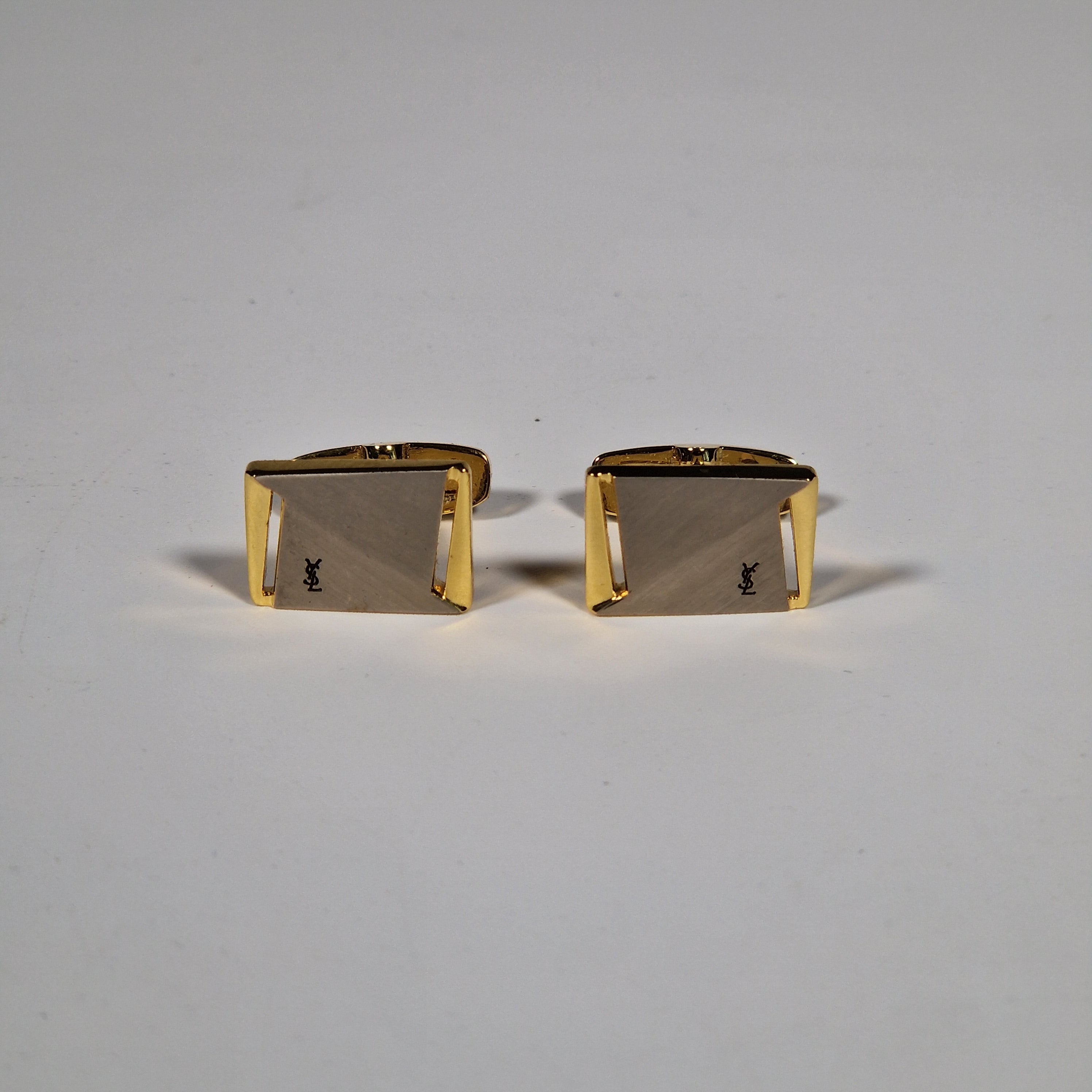 Yves Saint Laurent a pair of cufflinks with box.