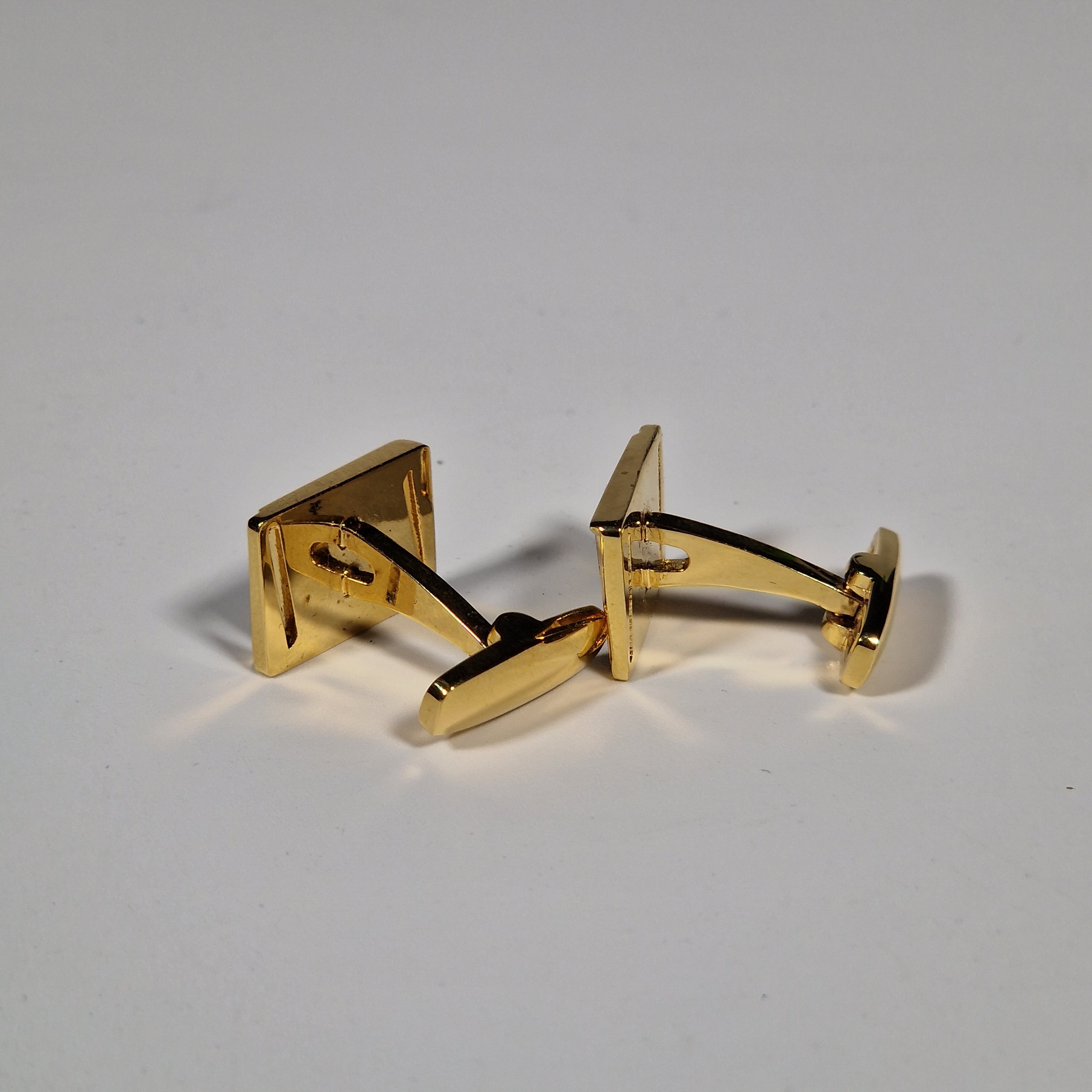 Yves Saint Laurent a pair of cufflinks with box.