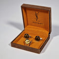 Yves Saint Laurent a pair of cufflinks and a tie pin with box.