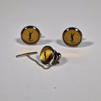 Yves Saint Laurent a pair of cufflinks and a tie pin with box.