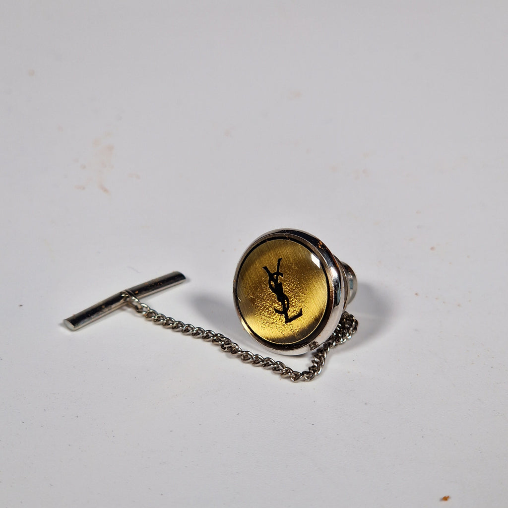 Yves Saint Laurent a pair of cufflinks and a tie pin with box.