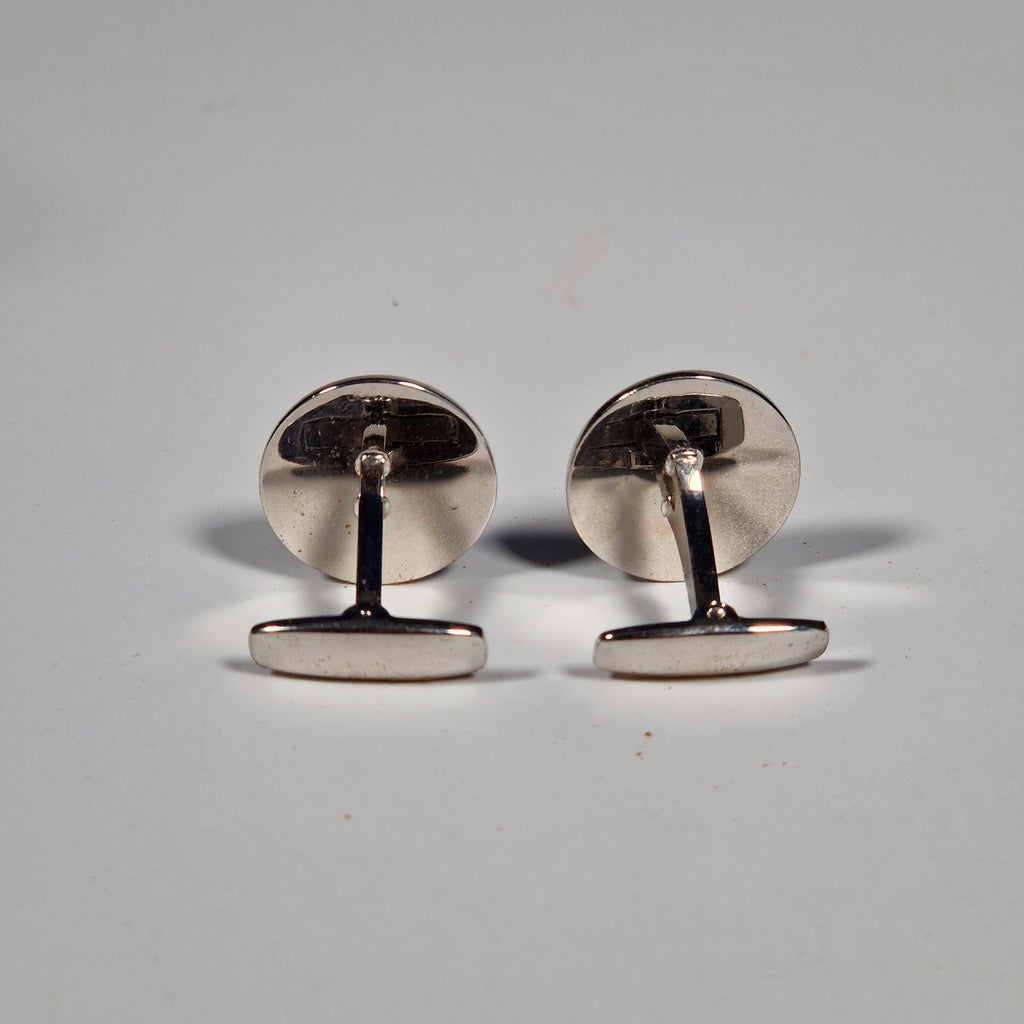 Yves Saint Laurent a pair of cufflinks and a tie pin with box.