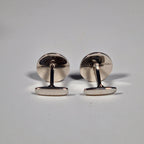 Yves Saint Laurent a pair of cufflinks and a tie pin with box.