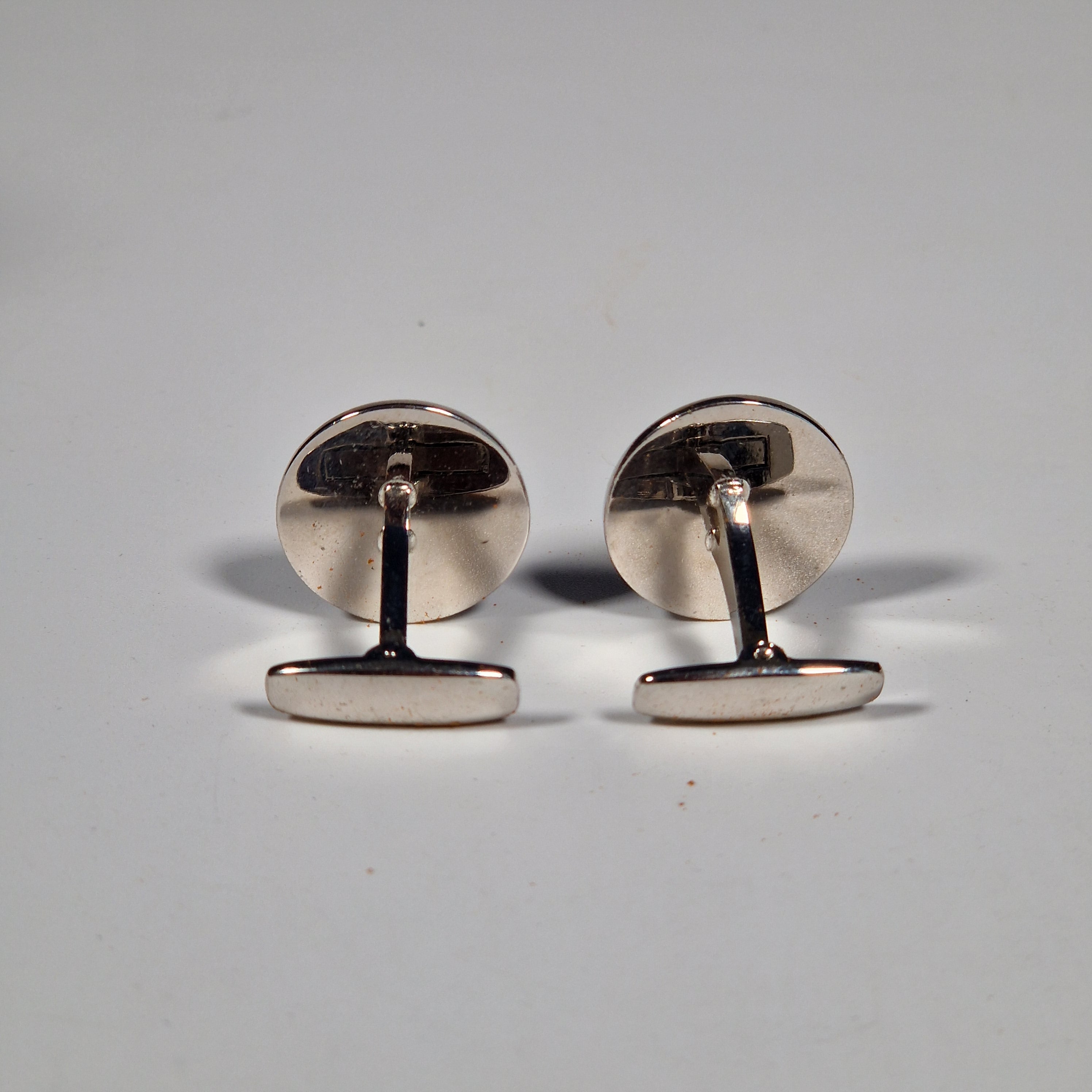 Yves Saint Laurent a pair of cufflinks and a tie pin with box.