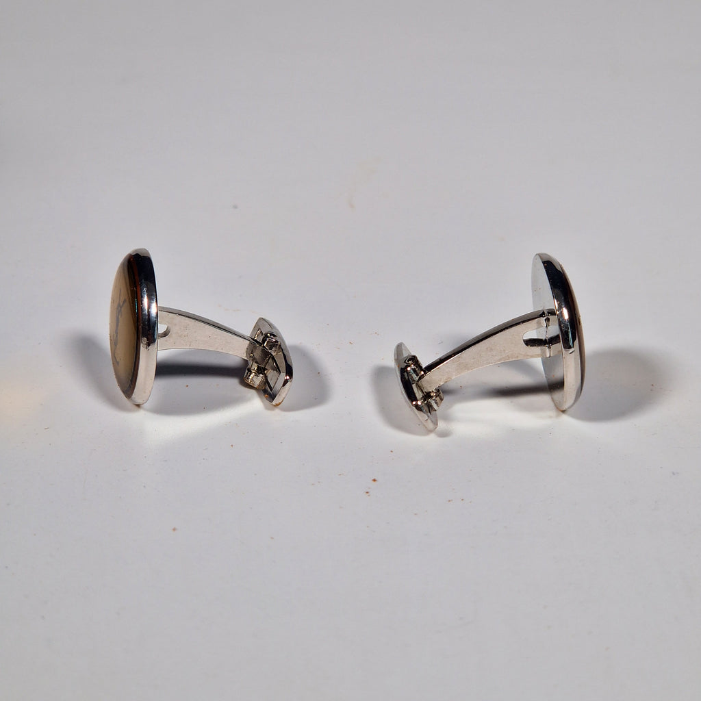 Yves Saint Laurent a pair of cufflinks and a tie pin with box.