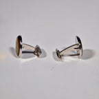 Yves Saint Laurent a pair of cufflinks and a tie pin with box.